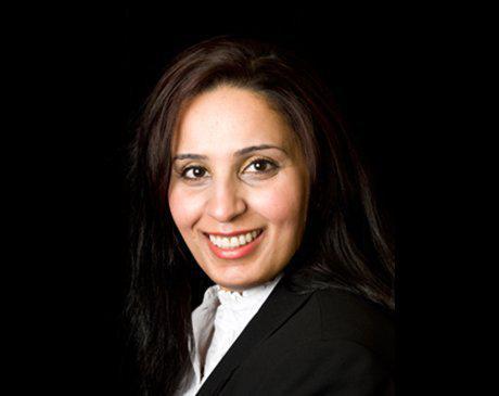 Portrait of Dr. Huda Albather, Periodontist and Implant Specialist