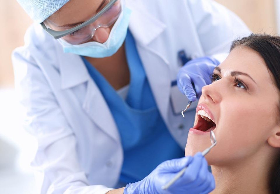 endodontist checking patient's mouth