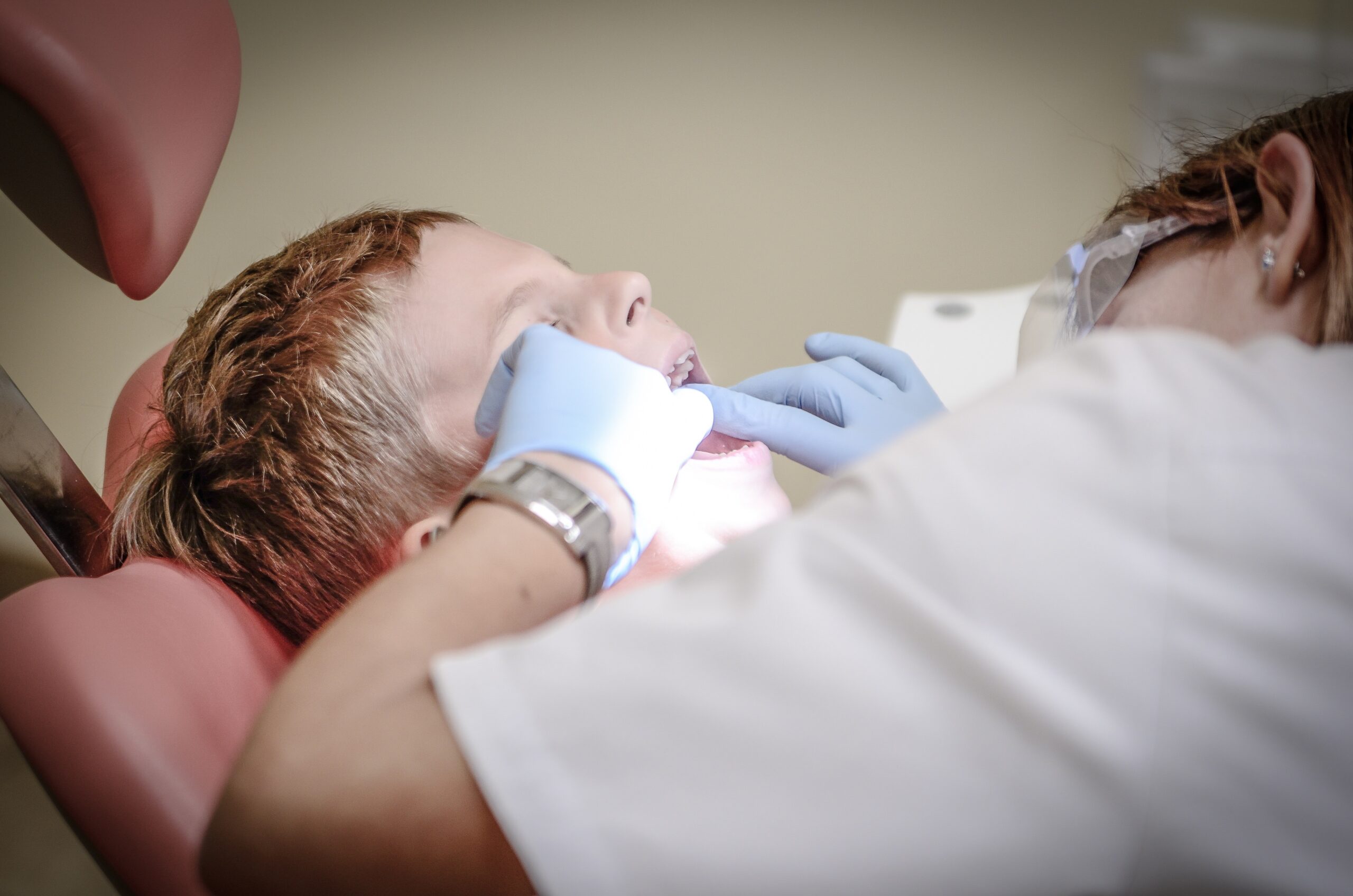 child with mouth open at dentist