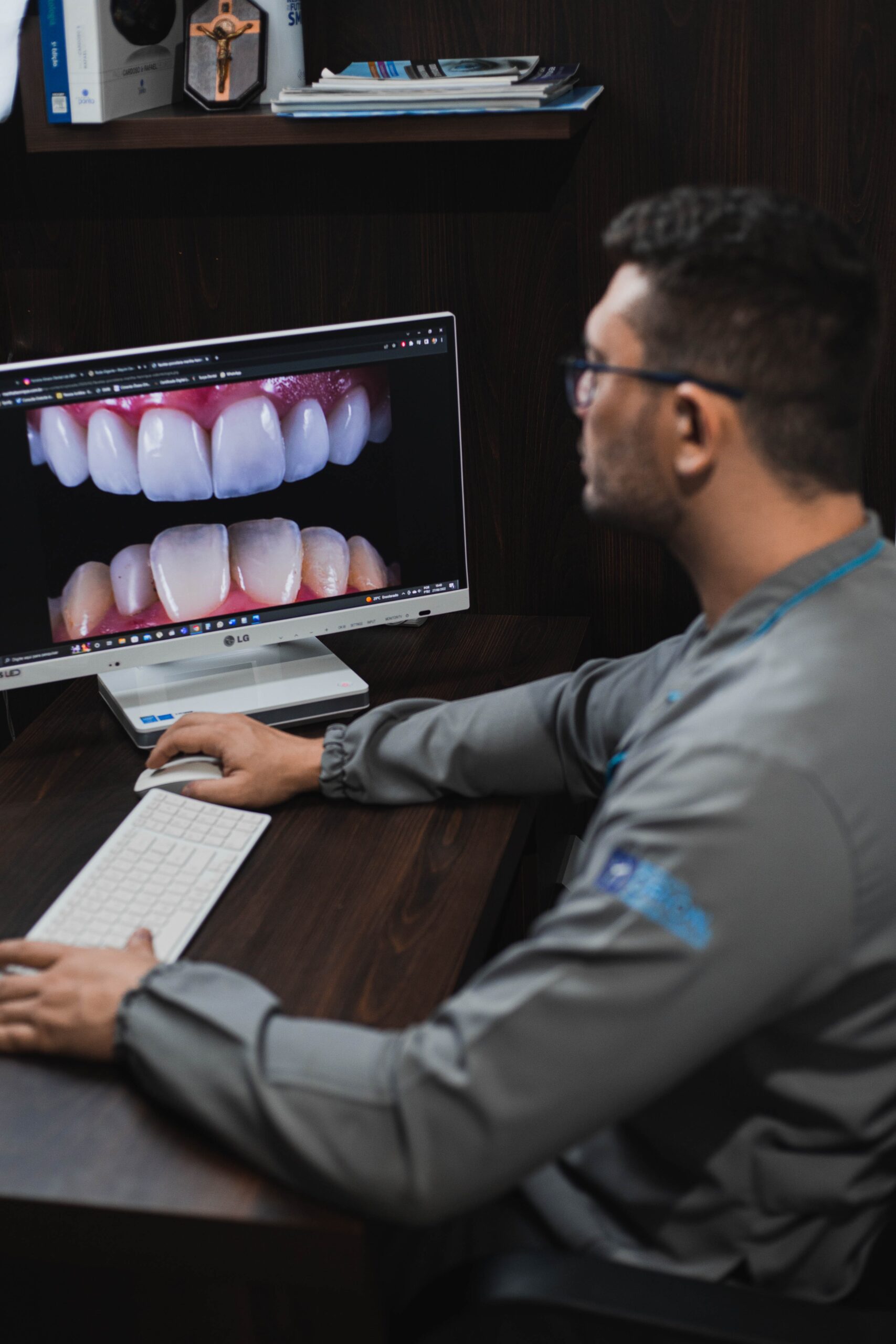 doctor looking at computer screen with a picture of teeth